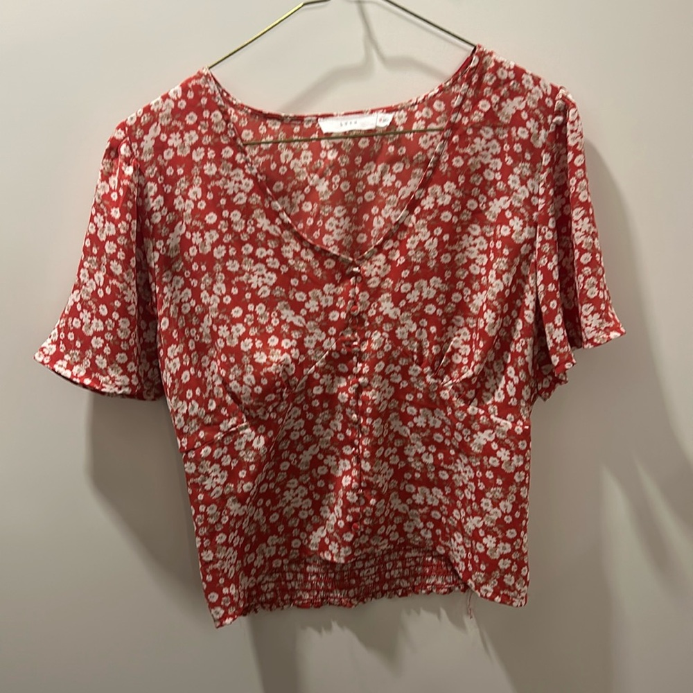 Reddish orange floral top